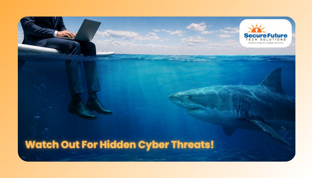 Businessman on laptop above shark symbolizing hidden cyber threats
